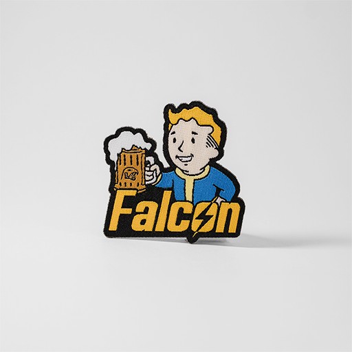 Gult och blått Fallout-tygmärke med texten "Falcon"