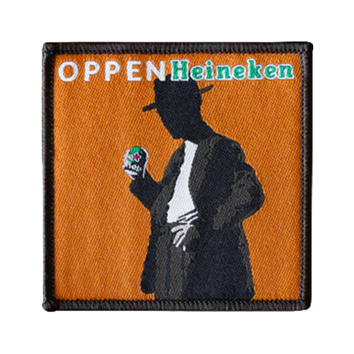 Orange tygmärke med texten "Oppenheineken"